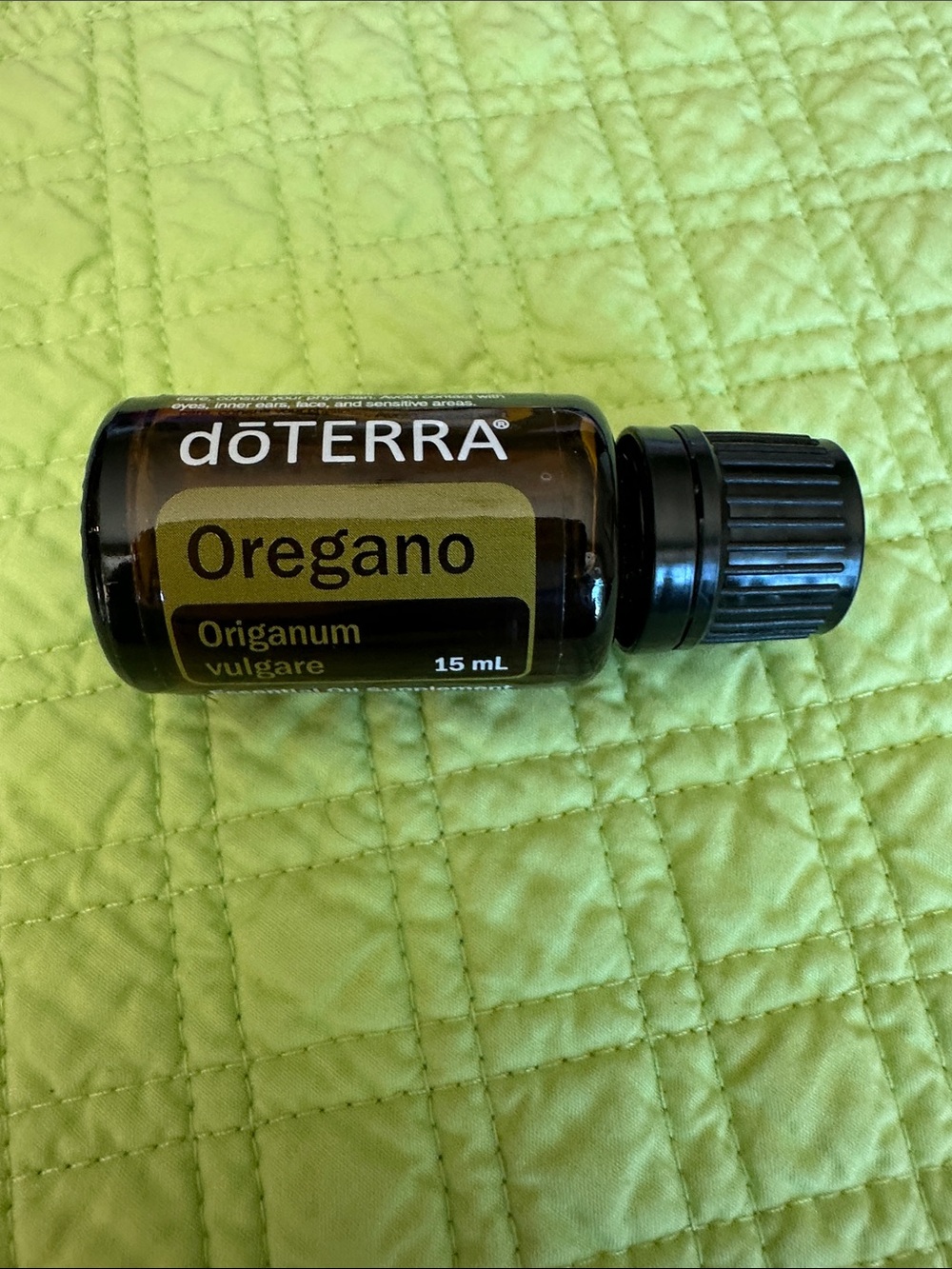 doTERRA Oregano Essential Oil - Brown Bottle with Black Cap on Green Label